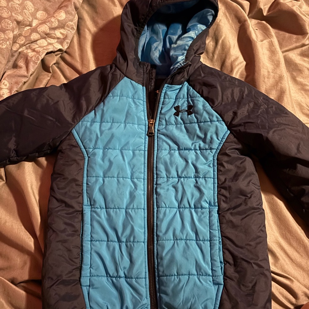 Boys Blue and Black coat in size 6. Has little stain.
